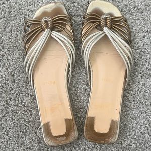 Christian Louboutin Castatane Metallic Leather Braided Flat Sandals.